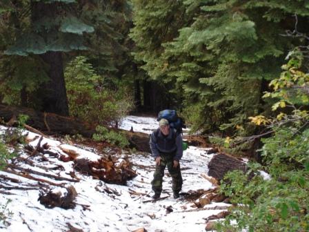 Schmuck 2 hauls bear canister up the trail